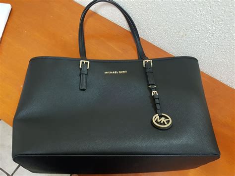 bolsa michael kors negra con cadena|michael kors husband.